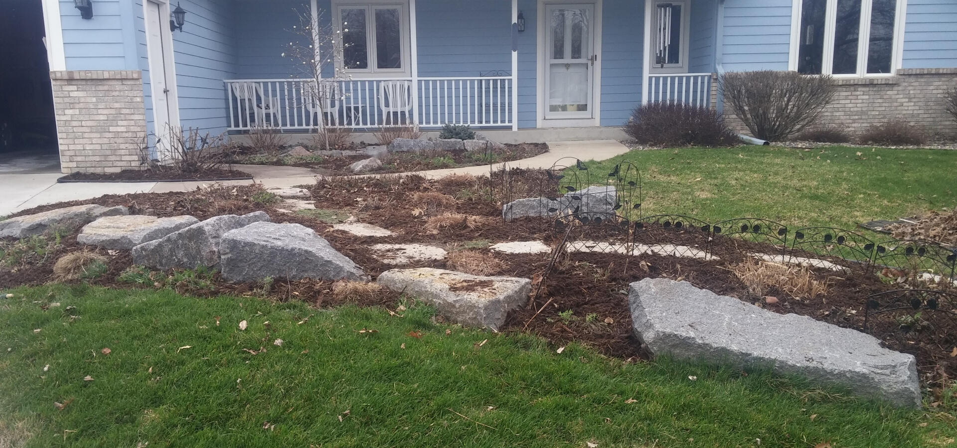 Outcrop stone accents for butterfly garden
